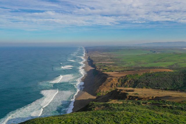 Breathtaking aerial view of Point Reyes National Seashore with sweeping coastline and lush landscapes.